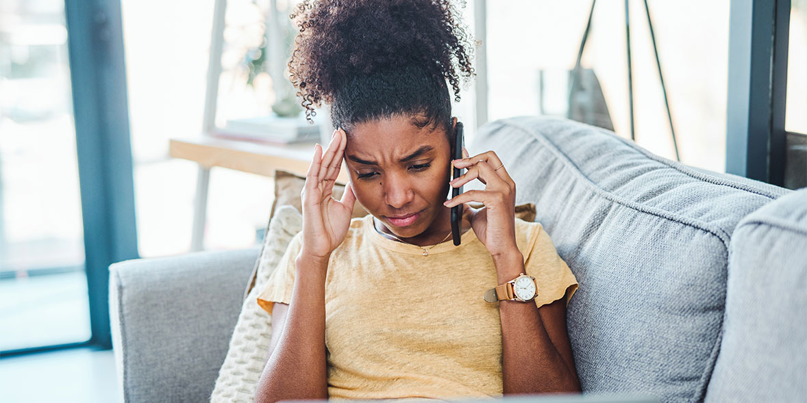 Frustrated woman on the phone to her energy company